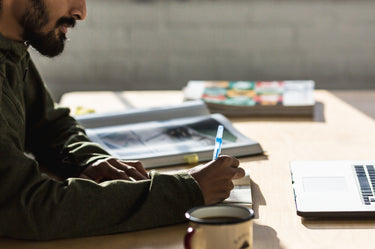 Man at a desk writing