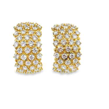 Vintage 18K huggie‚Äëhoop diamond earrings.